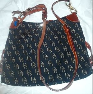 Dooney and Bourke long leather strap purse. Medium